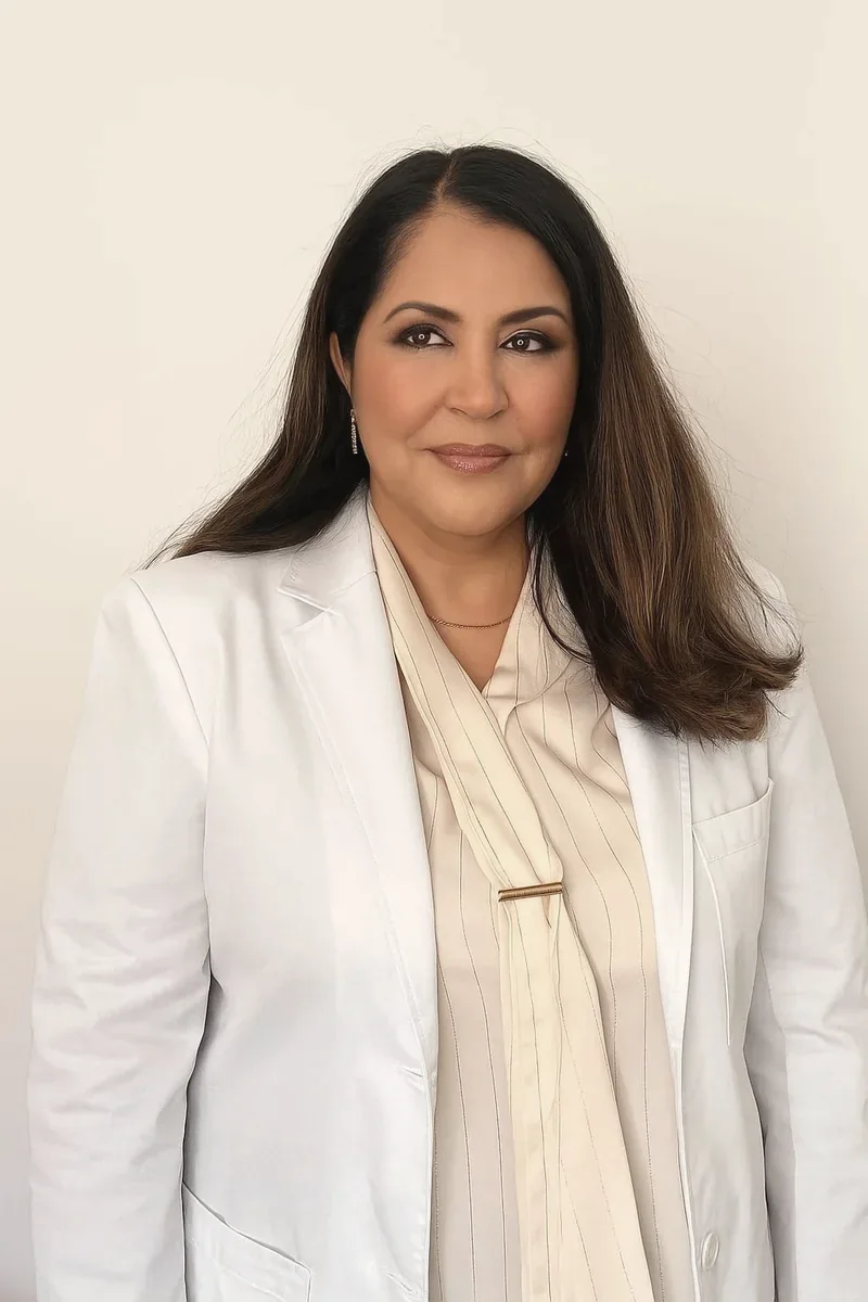Dr Zarghuna Taraki, doctor at SKNCode London Clinic, wearing a white coat